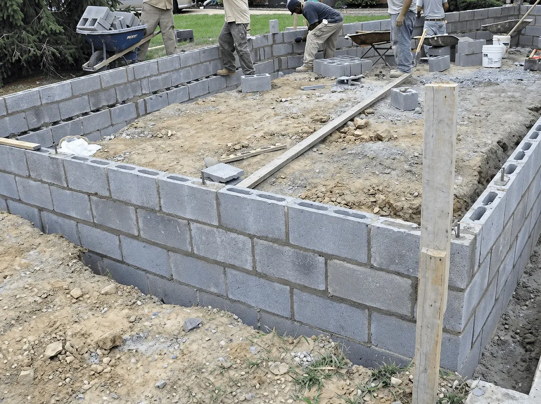 Professionals building a foundation with blocks in Staten Island, NY